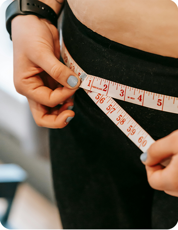 woman with tape measure on waist